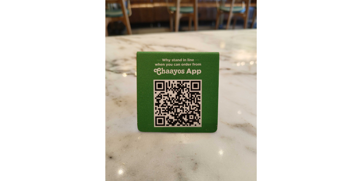 Chaayos QR Code table tent, which redirects users to download the app by scanning it.