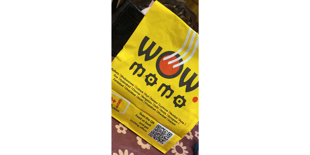 A QR Code for a survey on a coffee cup at a cafe.