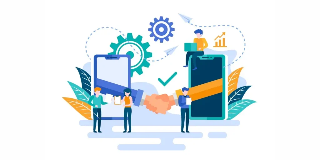 Two shaking hands in front of two smartphones with a person sitting with a laptop on one.