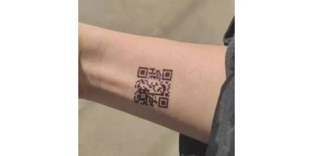 A QR Code tattoo on the forearm.