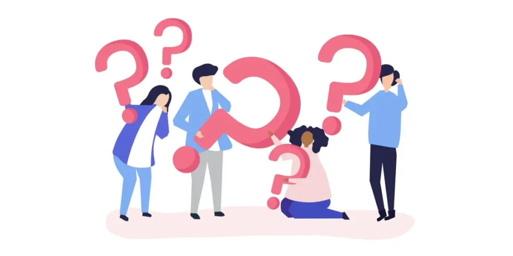 four women holding giant question marks