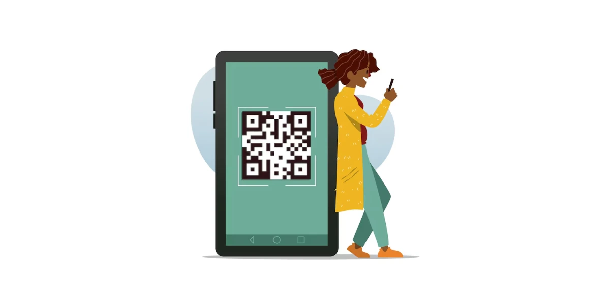 a woman standing near a giant mobile phone with a QR Code