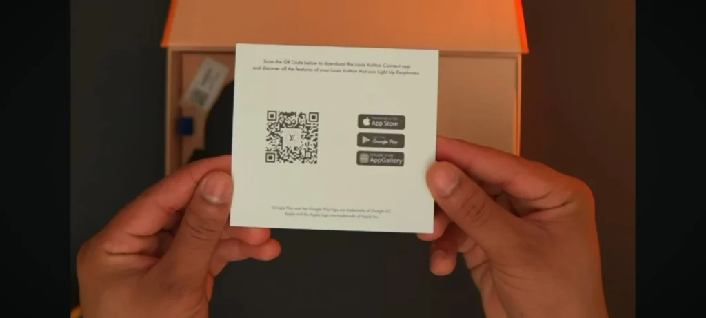 Hands holding LV QR Code card that links to the features page of product.