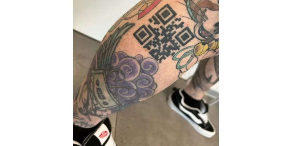 A vaccination QR Code tattoo on Andrea's arm.