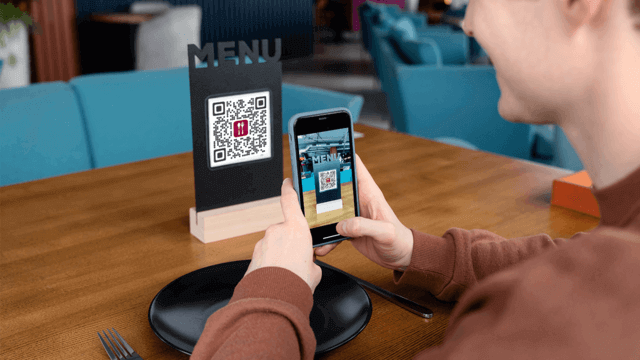 Screenshot of Scanova's My QR Code list page.
