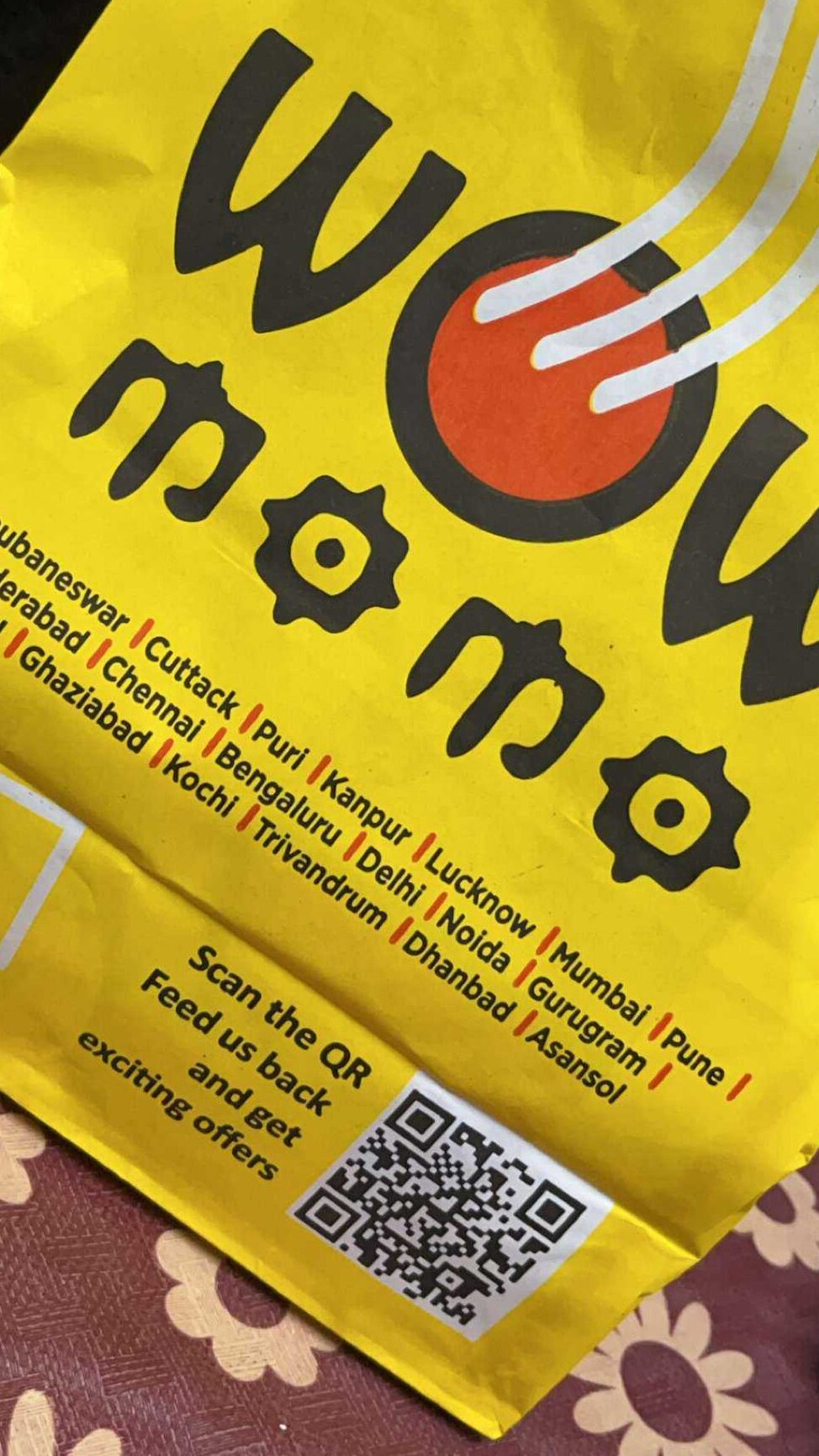Wow Momos packaging with a feedback QR Code on it.